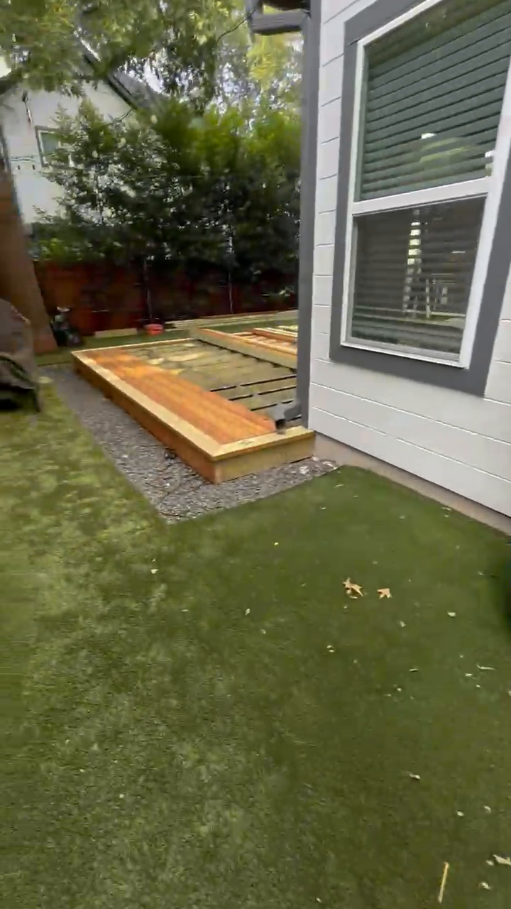 Cedar decking being fitted along the edge of the home at the start of a build